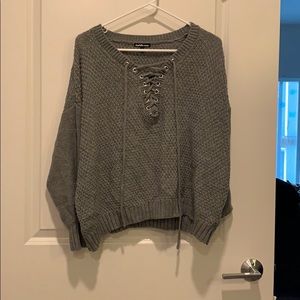 Slouchy grey sweater with neck ties